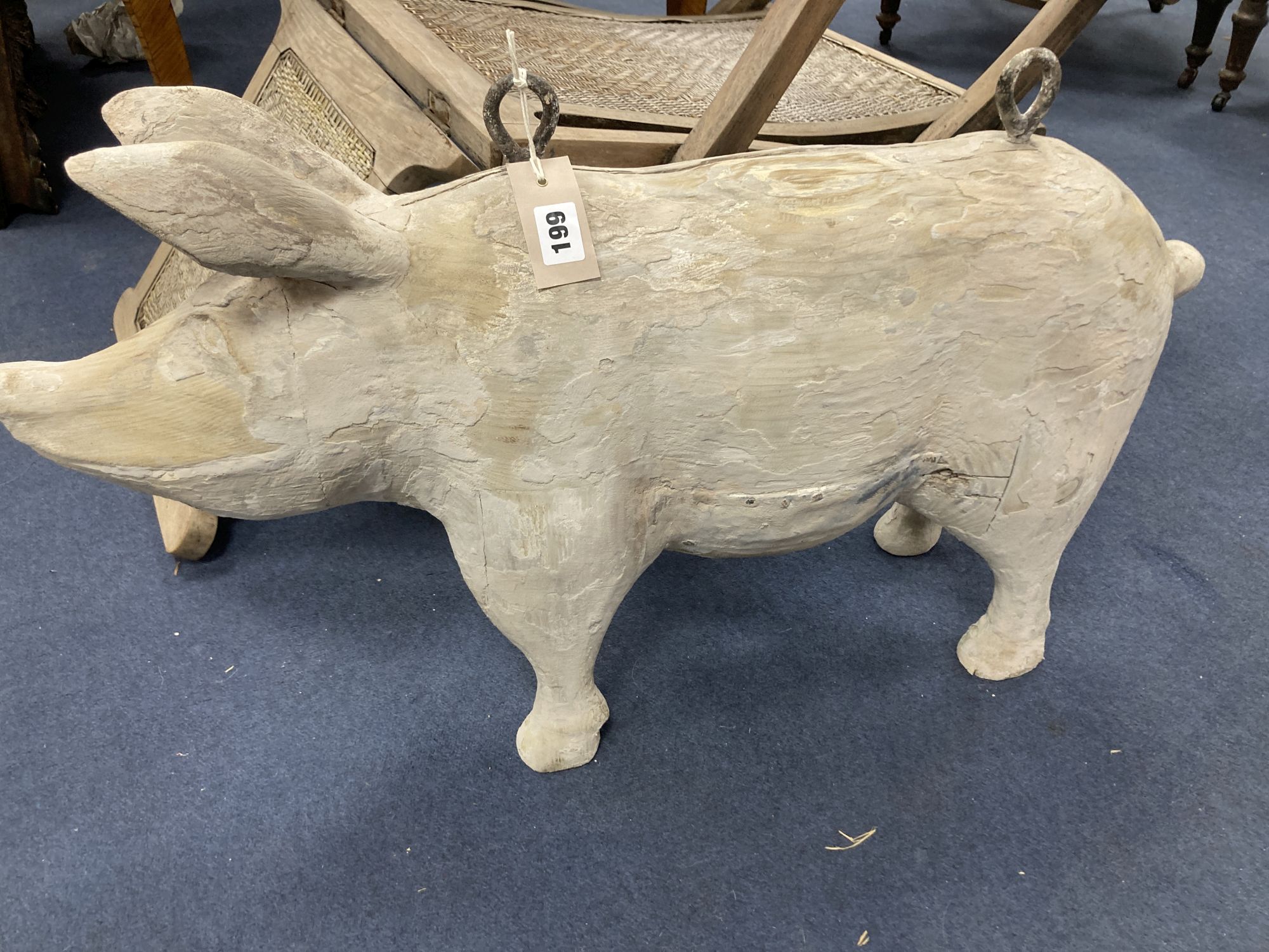 A carved wood butchers shop model of a pig, length 76cm